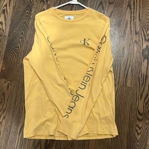 Yellow/Mustard long sleeve Calvin Klein t-shirt.